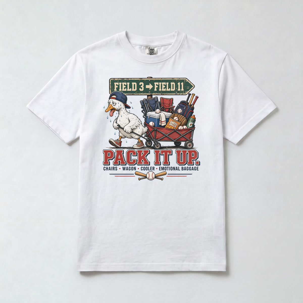 White Comfort Colors 1717 travel baseball parent shirt with Field 3 to Field 11 sign, goose, wagon and Pack It Up graphic.