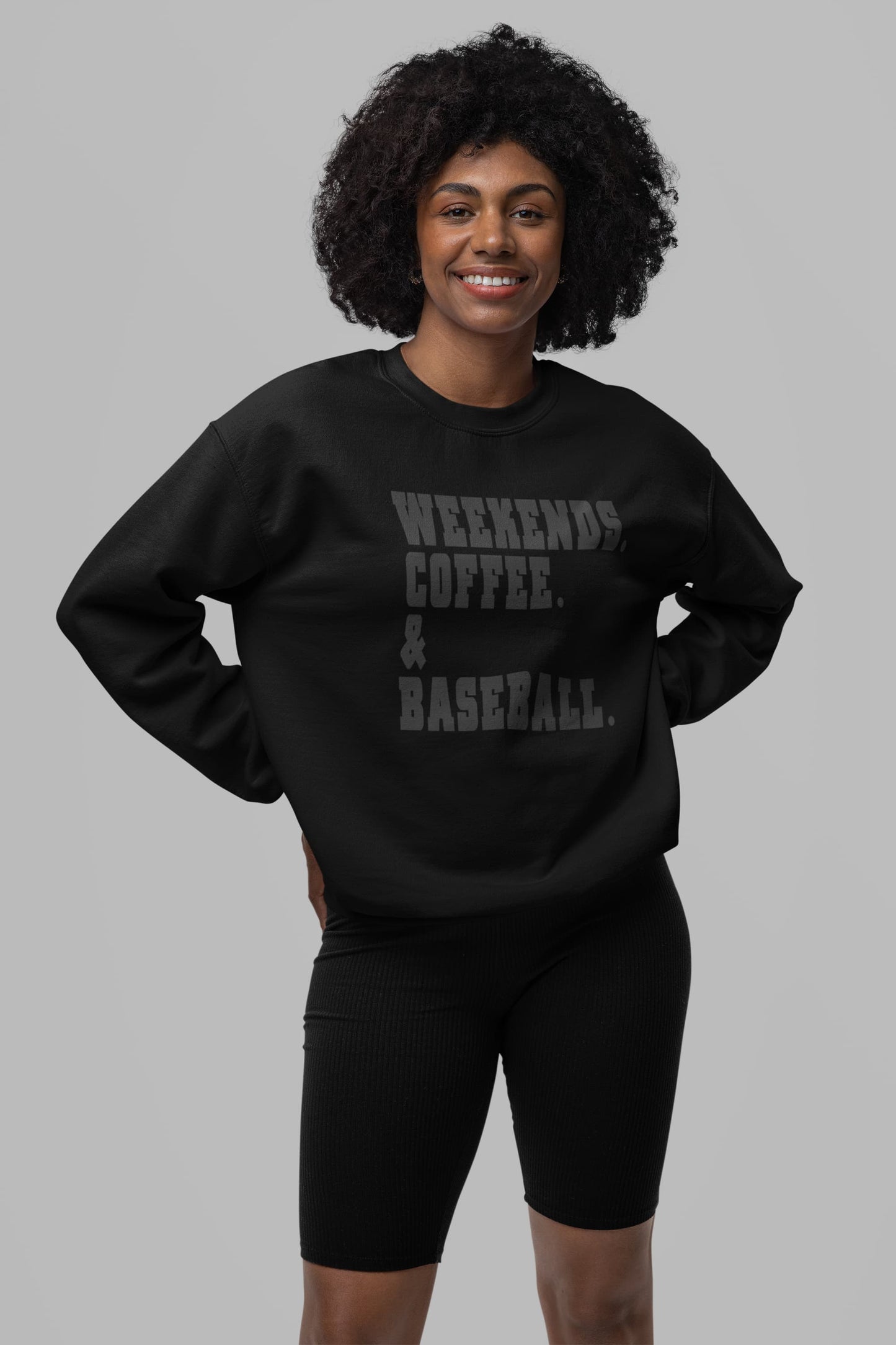 Woman wearing black weekends coffee baseball sweatshirt casual baseball mom weekend outfit